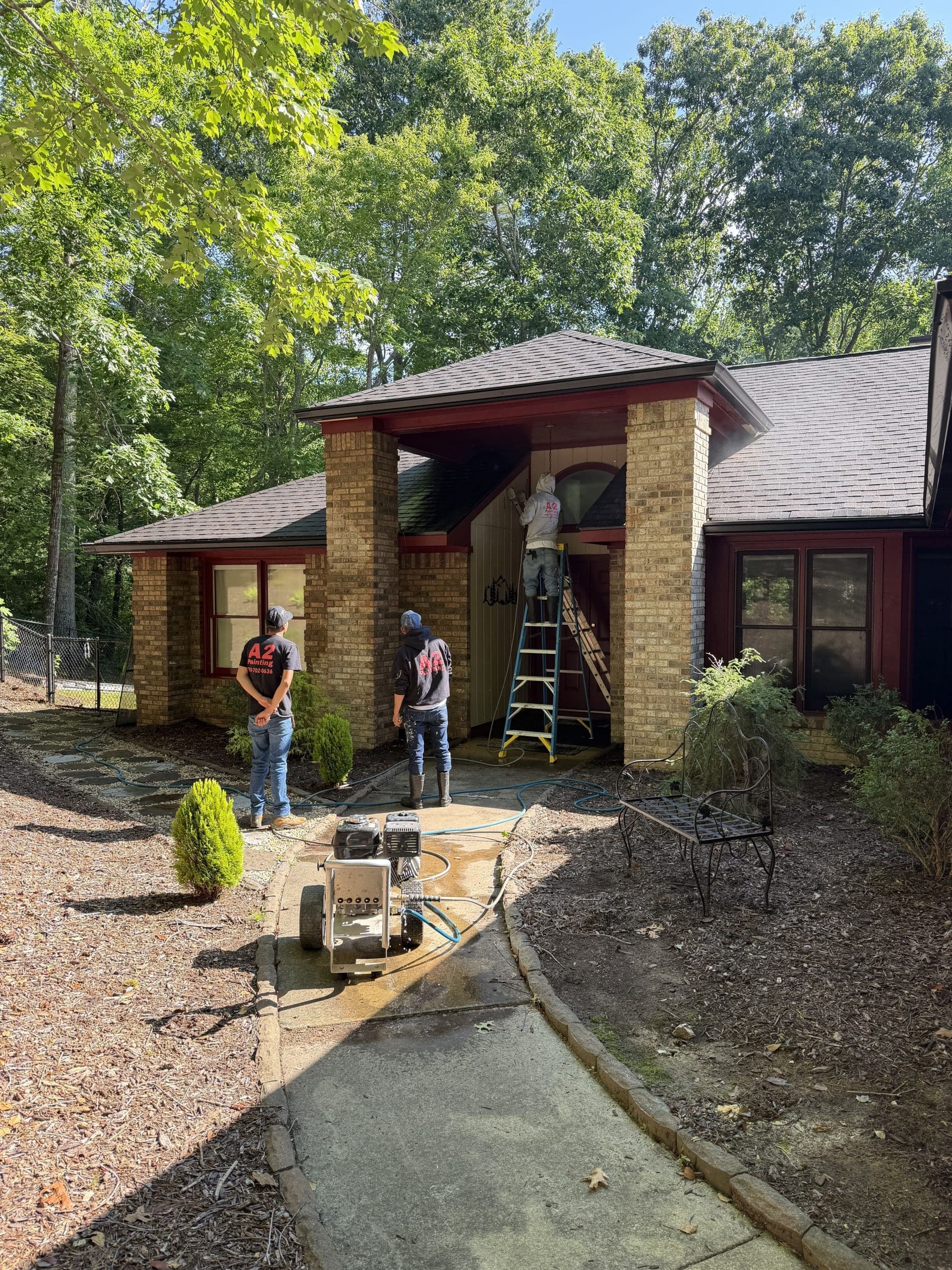 A2 Painting crew prepping a wooded lot home exterior as painters in Biltmore Park, NC