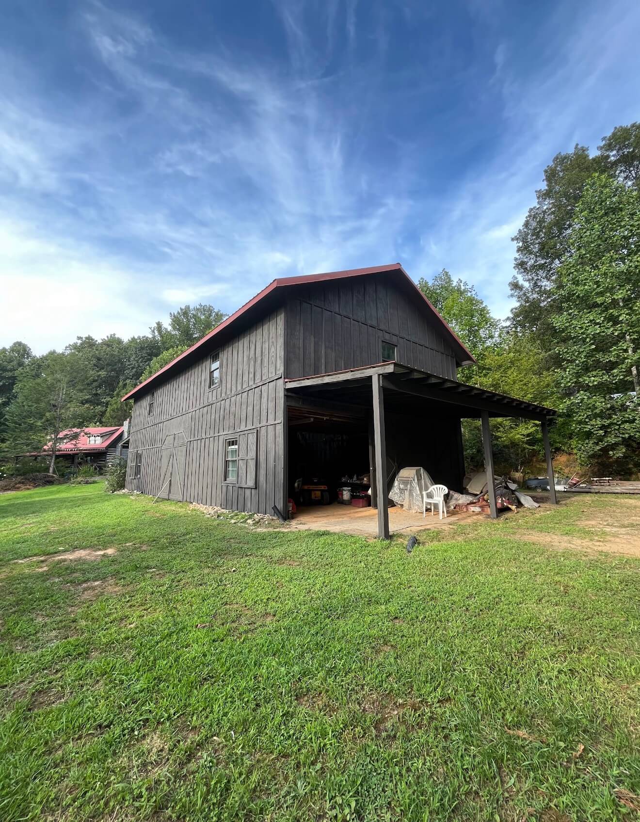 Stained barn siding on a rural property finished by painters in Fletcher, NC