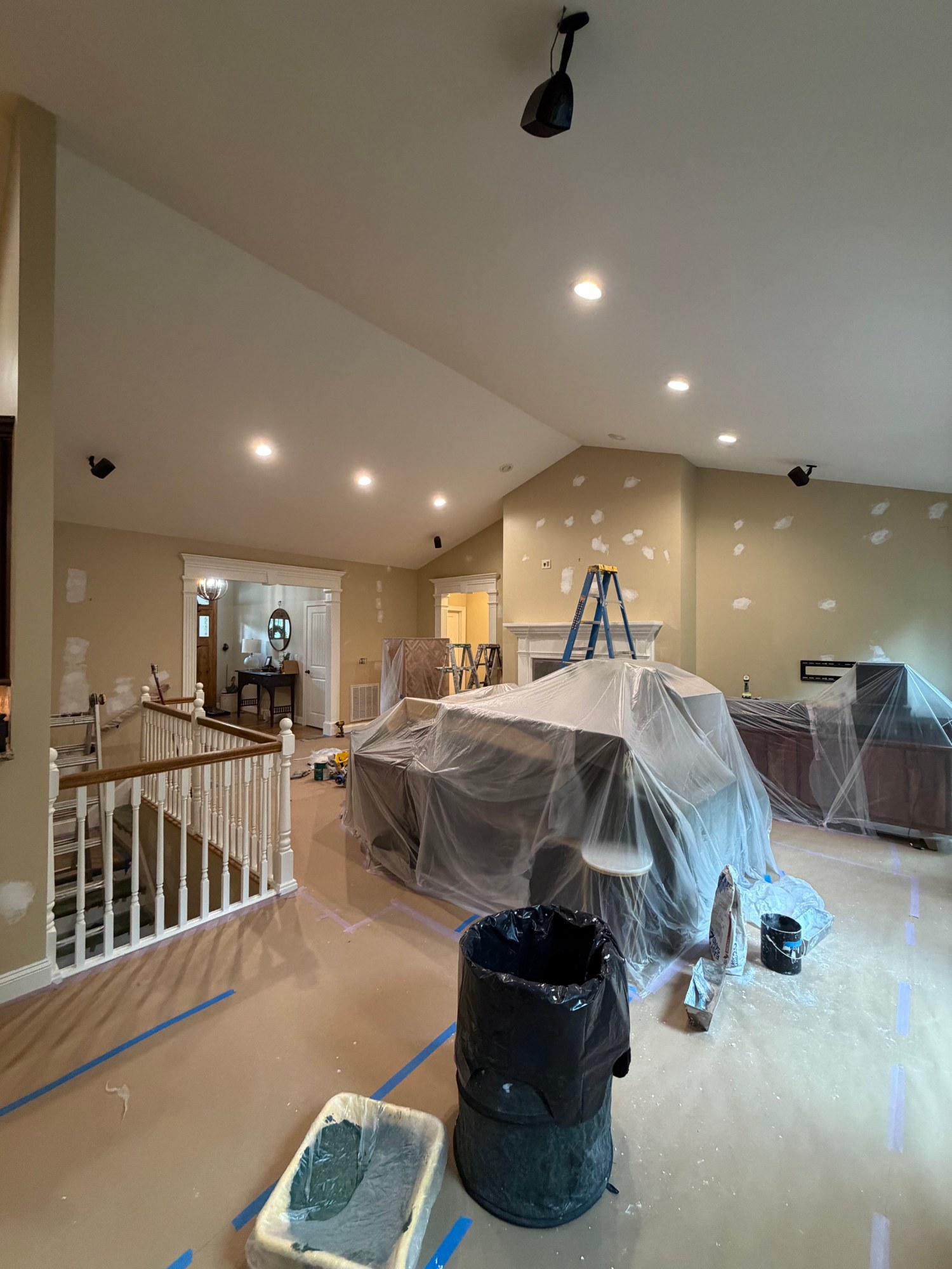 Vaulted ceiling painting in a large open floor plan home