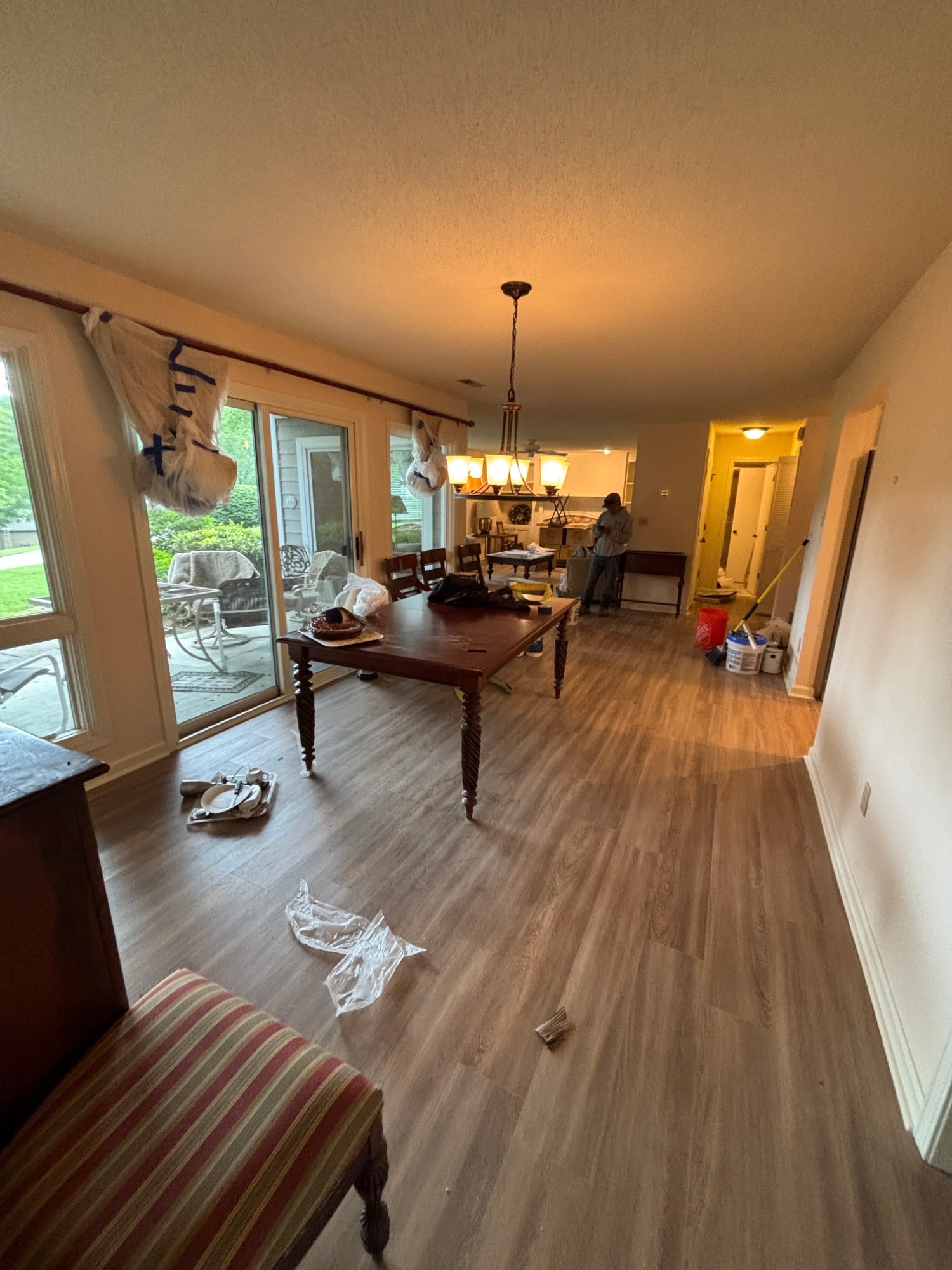 Long open dining room interior painting in a family home