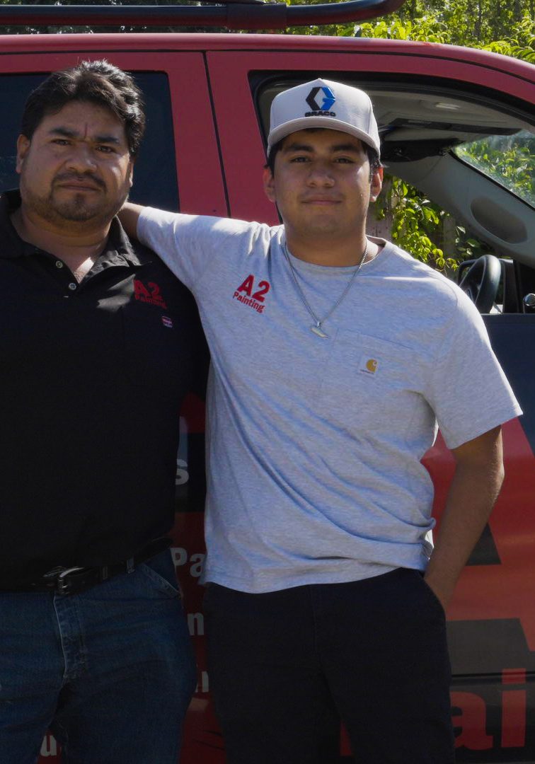 father and son owners of A2 Painting in front of company truck Hendersonville NC